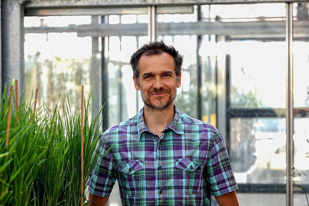 Portrait of the scientist taken in the greenhouse